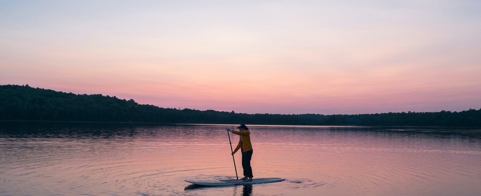 Woman paddle boarding in lake