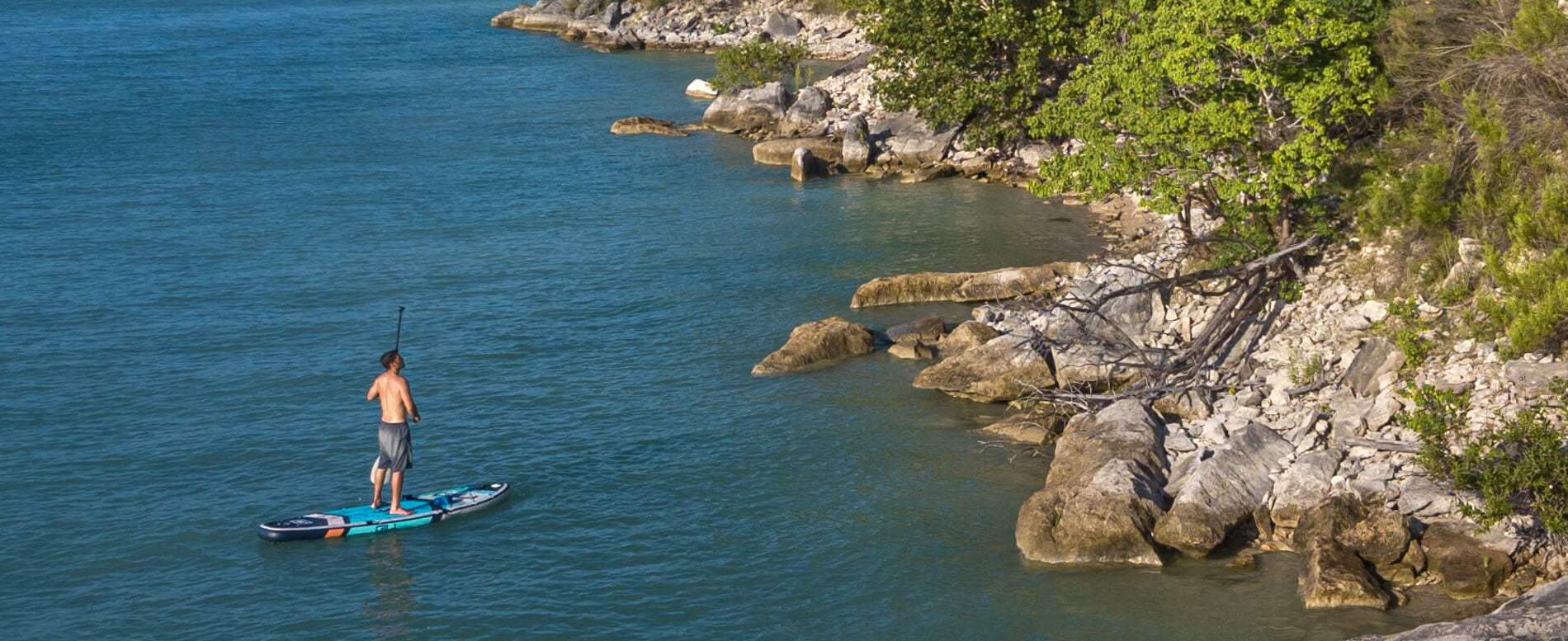 Man paddling on an inflatable paddle board