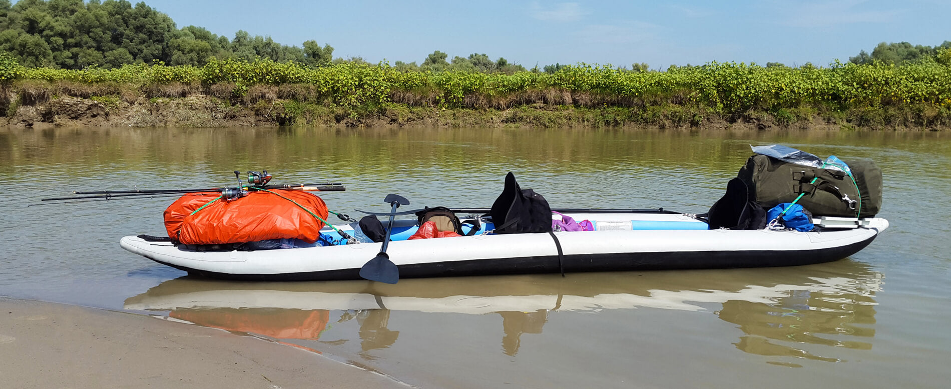 White inflatable kayak with accessories