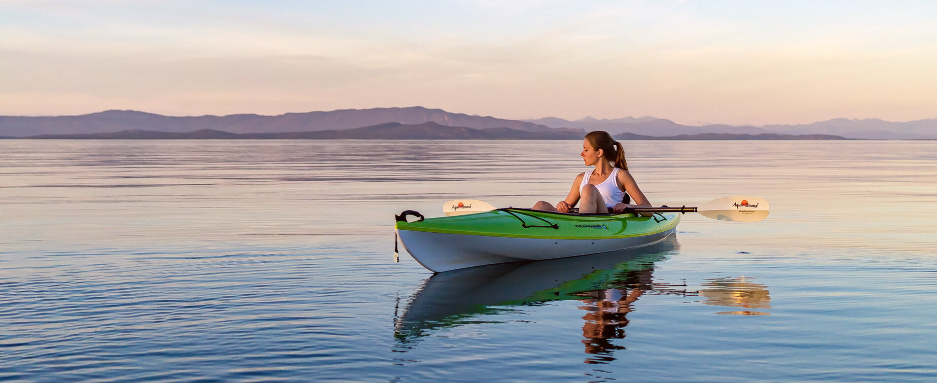 Woman on a green kayak