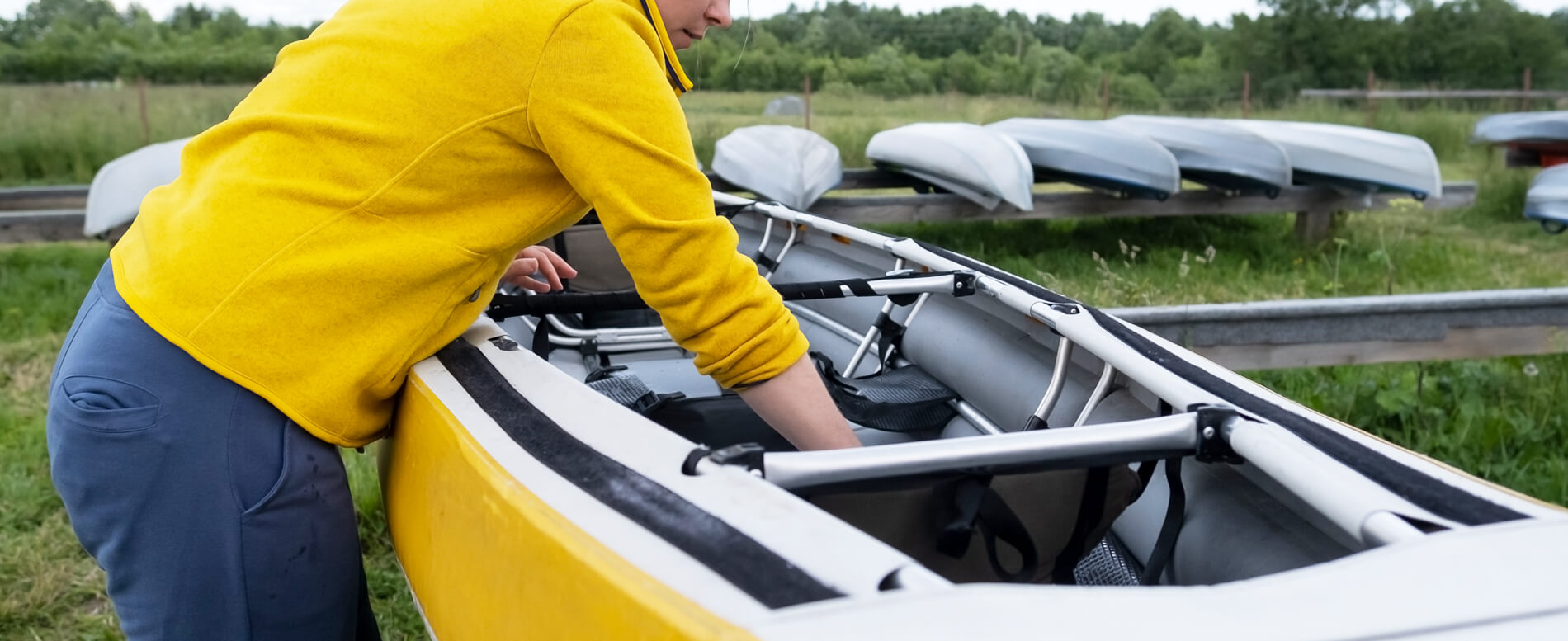 Woman cleaning the interior of her kayak