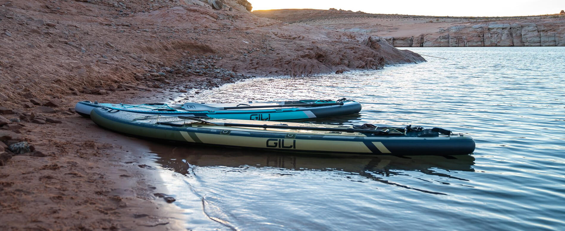 Two inflatable paddle boards on a lake