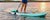 Woman paddle boarding on a lake