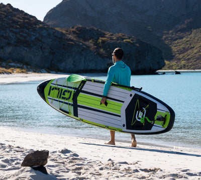 10'6 AIR Inflatable Paddle Board in Green at the beach